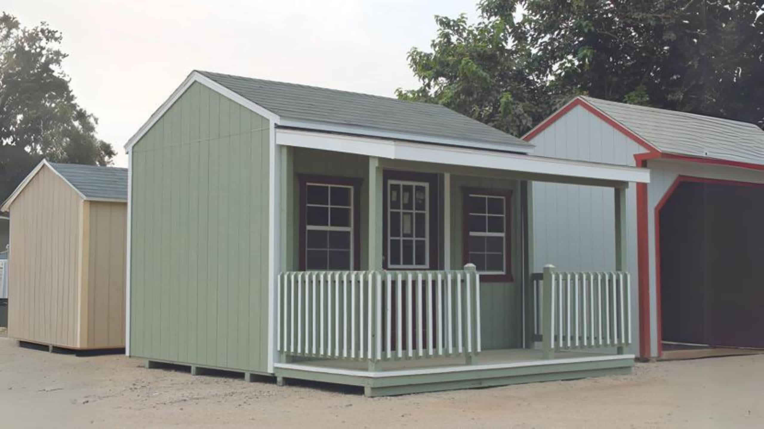 Teal cottage shed with porch