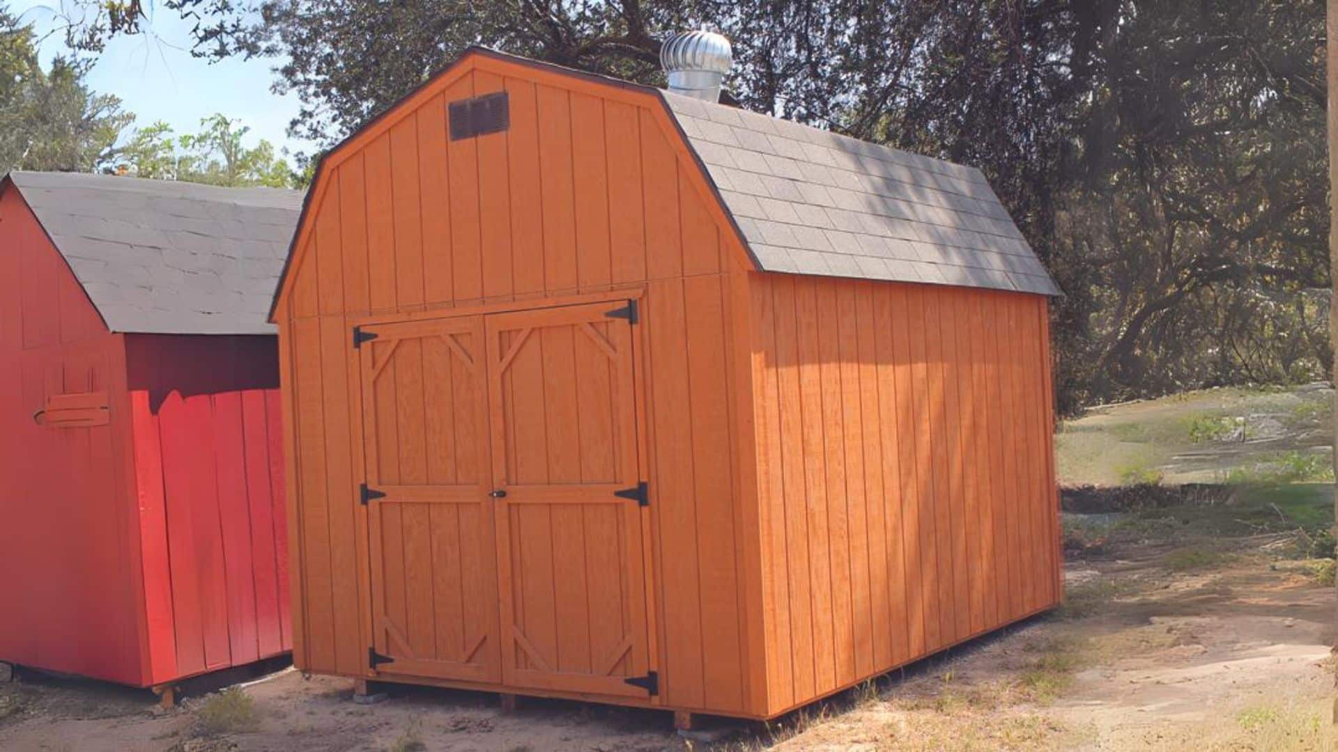 Orange lofted barn shed in shed lot