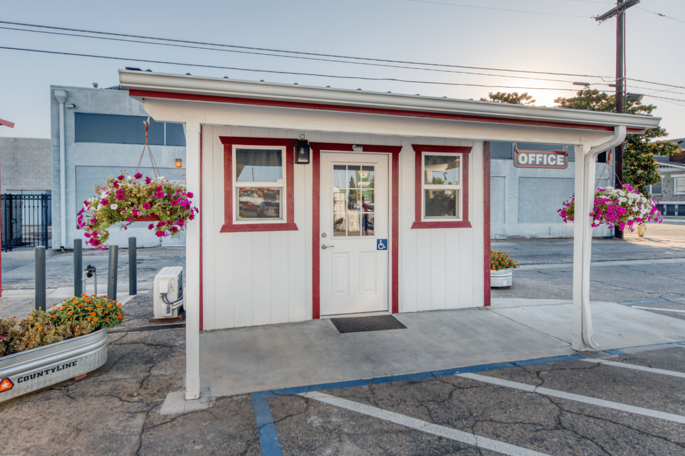 custom white commercial shed with red trim and porch in dunlap ca