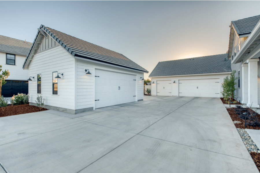 custom white attached and detached garages that can be utilized as garage conversion ADUs