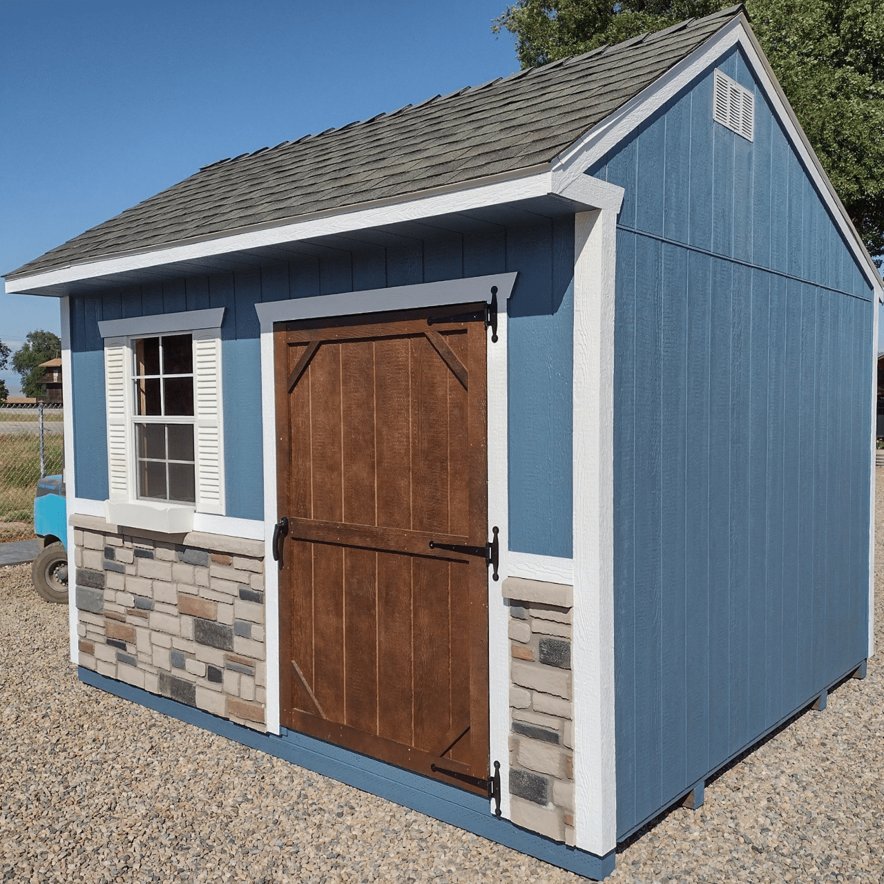 blue deluxe garden shed with wooden doors and window in dunlap ca