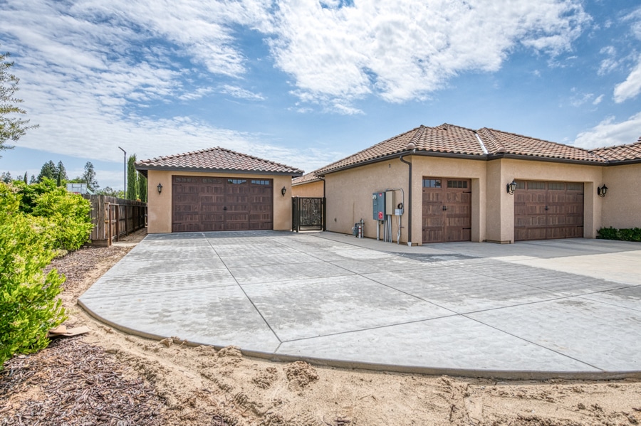 detached one car garage built to match attached garage of existing home