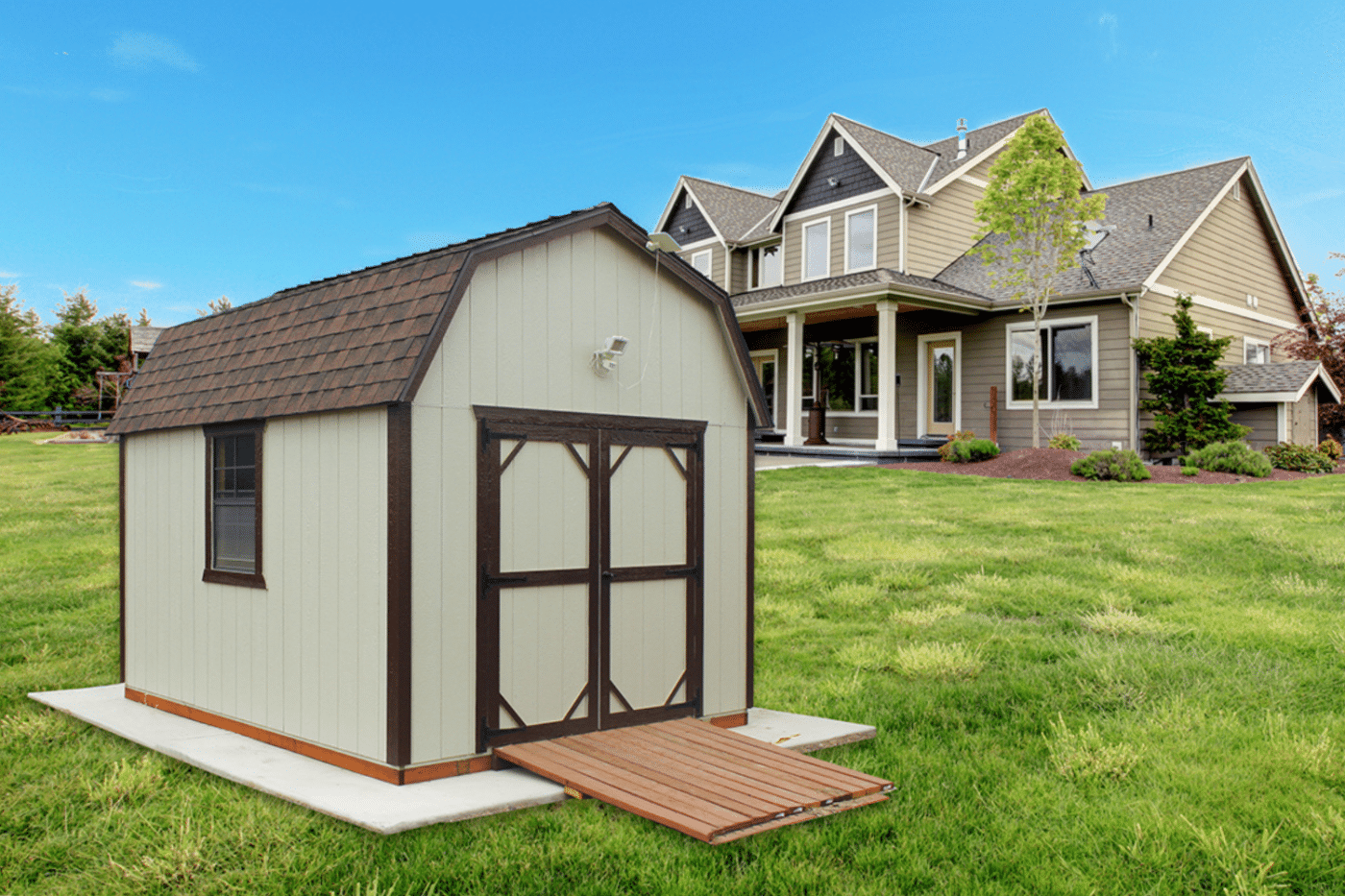 beige shed with wooden ramp and brown trim in front of house in dunlap ca