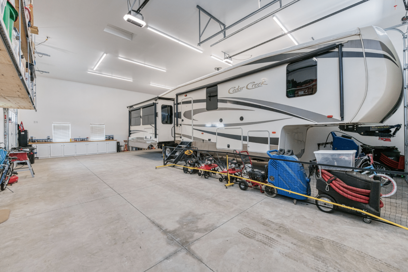 inside of two car garage with camper in dunlap ca