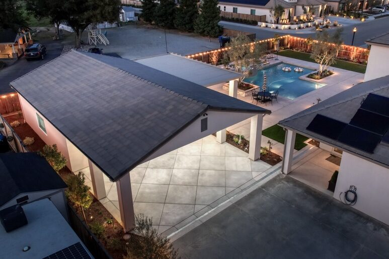 overhead view of one car garage by pool at night