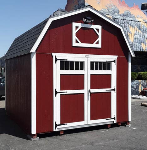 red and white trimmed barn elite shed with transom windows on doors