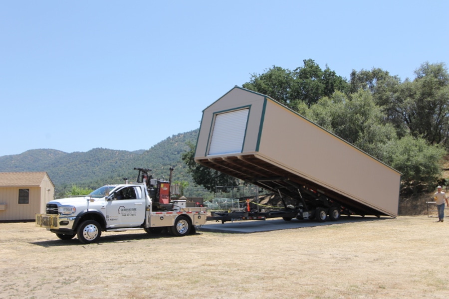 tan and green trimmed garage being delivered on site in California after proper permits obtained