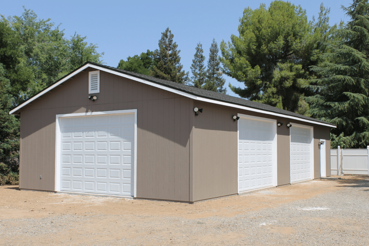 beige three car garage with white doors in dunlap ca