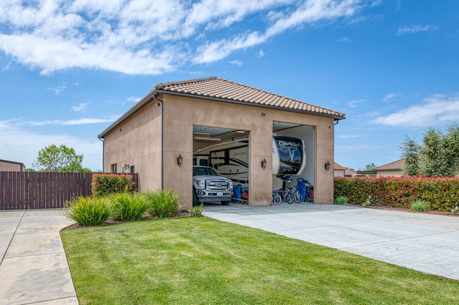 two car garage with different size openings to fit a truck and camper