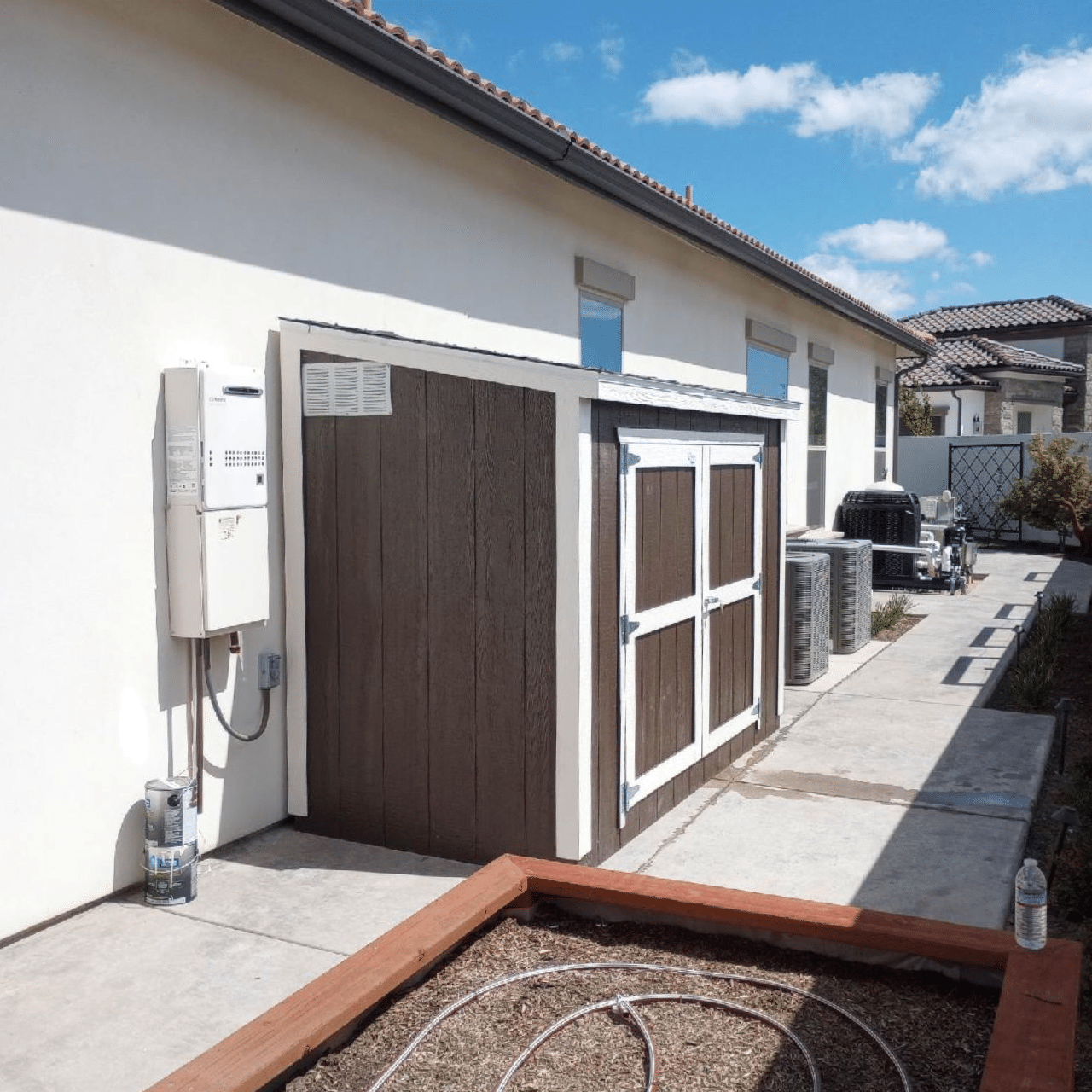 brown value lean to shed with white siding in dunlap ca