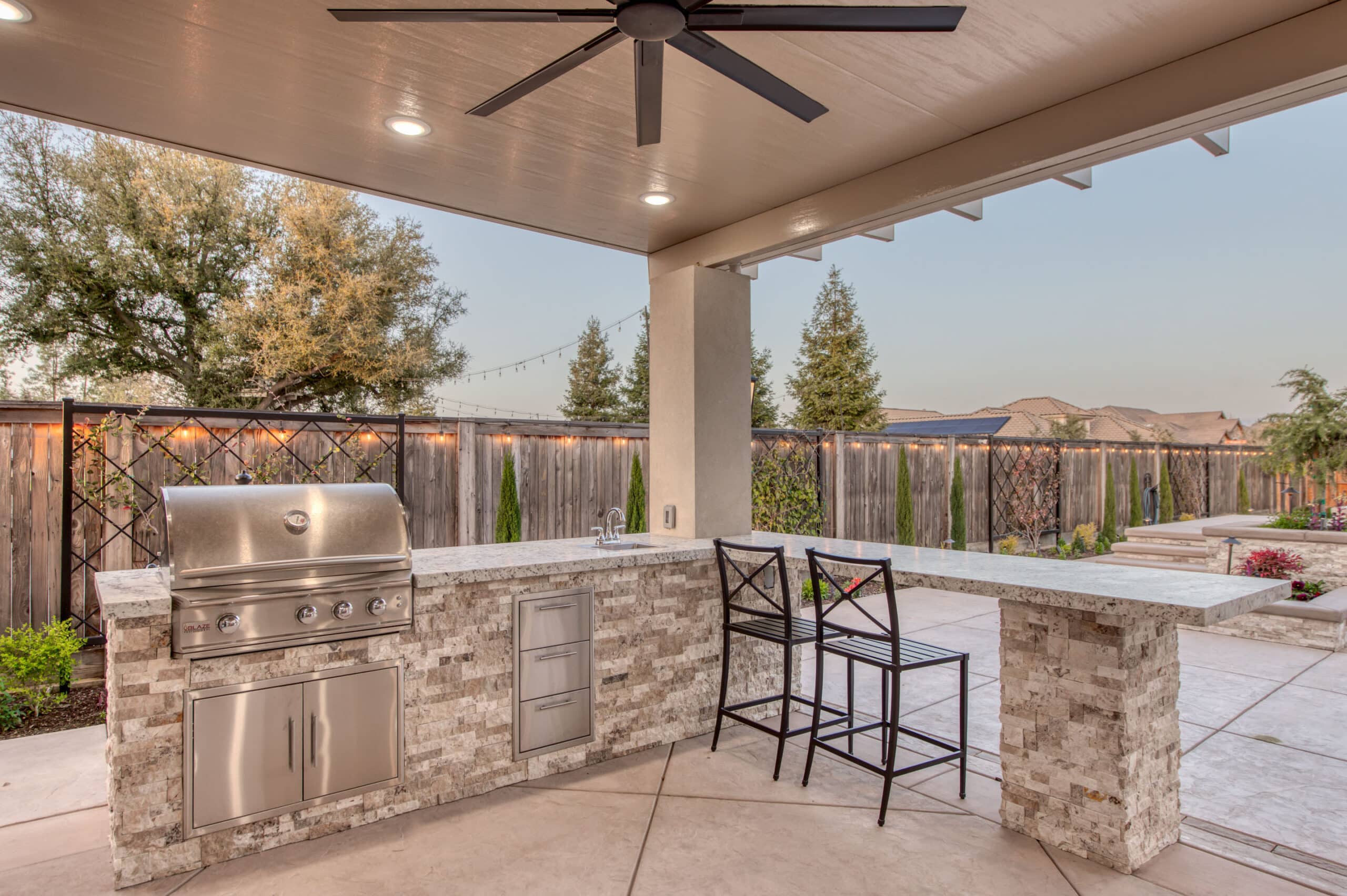 view of marble countertop bar seating area and grill