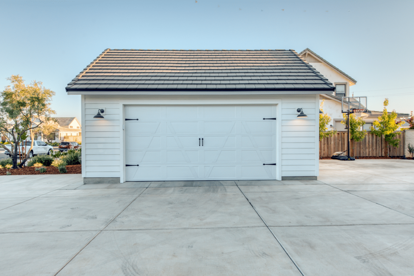 white detached one car garage with white door in dunlap ca